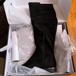 Black knee high boots , perfect to wear with jeans or dresses or leggings